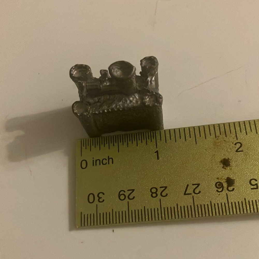 Small metal castle like piece